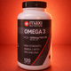 Maxi Nutrition Omega 3 supplement bottle on a red background